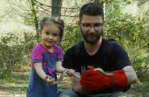 Ilian Velikov and his daughter with a Ladder Snake (Rhinechis scalaris), Sant Cugat